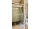 Modern bathroom featuring a glass-enclosed shower with tiled walls at 6258 Westcott Cove Blvd, Orlando, FL 32829