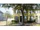 Charming townhome with neutral exterior, black shutters, well-maintained landscaping, and inviting front door at 6258 Westcott Cove Blvd, Orlando, FL 32829
