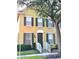 Charming two-story home with a welcoming front door, white railings, and lovely curb appeal at 6258 Westcott Cove Blvd, Orlando, FL 32829