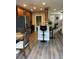 Open kitchen with stainless appliances, wooden cabinets, and counter seating at 6258 Westcott Cove Blvd, Orlando, FL 32829