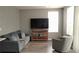 Comfortable living room with a sofa, armchair, and entertainment center at 6258 Westcott Cove Blvd, Orlando, FL 32829