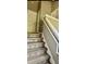 Staircase with hardwood treads and white risers at 6258 Westcott Cove Blvd, Orlando, FL 32829