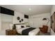 Comfortable bedroom with a queen bed, stylish decor, and a view from the windows at 7315 Capstone Dr, Groveland, FL 34736