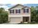 Charming two-story home with a two-car garage, stone accents and a beautifully landscaped yard at 7315 Capstone Dr, Groveland, FL 34736