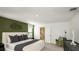 Primary bedroom with stylish decor, featuring gray and olive green tones at 7315 Capstone Dr, Groveland, FL 34736