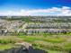 Expansive aerial view of the community highlighting its location near a lake and city amenities at 7398 Alpine Butterfly Ln, Orlando, FL 32819