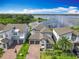Beautiful, modern, two-story home with a well-kept lawn in a desirable neighborhood with lake access at 7398 Alpine Butterfly Ln, Orlando, FL 32819