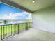 Balcony with views of the lake at 7398 Alpine Butterfly Ln, Orlando, FL 32819