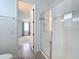 Modern bathroom featuring an elegant tiled shower and neutral color pallette at 7398 Alpine Butterfly Ln, Orlando, FL 32819