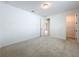 Neutral bedroom with carpet, white trim, and access to the bathroom and walk-in closet at 7398 Alpine Butterfly Ln, Orlando, FL 32819