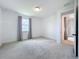 Spacious bedroom with carpet and a view of the water outside the window at 7398 Alpine Butterfly Ln, Orlando, FL 32819