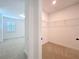Hallway view featuring an open room and closet space with wire shelving at 7398 Alpine Butterfly Ln, Orlando, FL 32819