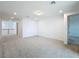 Open loft area featuring neutral carpet, recessed lighting, and hallway access at 7398 Alpine Butterfly Ln, Orlando, FL 32819