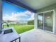 Covered patio with an outdoor sink and lake views at 7398 Alpine Butterfly Ln, Orlando, FL 32819