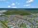 Overhead view displaying a Primary-planned community with lush landscaping, water features and easy highway access at 7564 Marker Ave, Kissimmee, FL 34747