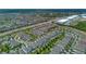 Wide aerial perspective of a neighborhood with many homes featuring private pools and well-kept landscaping at 7564 Marker Ave, Kissimmee, FL 34747