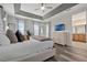The main bedroom offers ample space and contains an ensuite bathroom and a built-in television at 7564 Marker Ave, Kissimmee, FL 34747