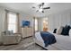 Bright bedroom with neutral walls, wood flooring, and natural light at 7564 Marker Ave, Kissimmee, FL 34747