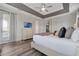 A bright main bedroom with direct access to the balcony and an ensuite bathroom at 7564 Marker Ave, Kissimmee, FL 34747