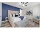 Comfortable bedroom features wood flooring, a tufted headboard, and recessed lighting at 7564 Marker Ave, Kissimmee, FL 34747