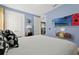 Themed bedroom featuring a playful design, wood flooring, and a TV at 7564 Marker Ave, Kissimmee, FL 34747