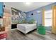 This uniquely-themed bedroom features custom wall art and decor and a modern bed at 7564 Marker Ave, Kissimmee, FL 34747