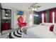 A playful bedroom contains unique furniture, quirky decorations, and an ensuite bathroom at 7564 Marker Ave, Kissimmee, FL 34747