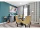 Cozy dining area in the theater room featuring fun wallpaper and colorful accents at 7564 Marker Ave, Kissimmee, FL 34747