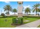 Elegant entrance to Encore Resort at Reunion, with palm trees, manicured landscaping and iconic signage at 7564 Marker Ave, Kissimmee, FL 34747