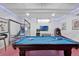 Entertaining game room features a pool table, basketball game, arcade, and fun decor at 7564 Marker Ave, Kissimmee, FL 34747