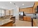 Well-equipped kitchen with granite countertops, stainless steel appliances, and modern fixtures at 7564 Marker Ave, Kissimmee, FL 34747