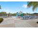 Spacious pool deck with lounge chairs, umbrellas, and waterpark views, providing a relaxing resort experience at 7564 Marker Ave, Kissimmee, FL 34747