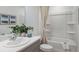 Clean bathroom features a tub and neutral color palette at 7751 Waterscape Dr, Groveland, FL 34736