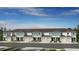 New townhome exteriors showcasing covered entries, single car garages, and beautifully landscaped front yards at 7751 Waterscape Dr, Groveland, FL 34736