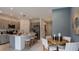 Modern kitchen with a large island and seating at 7751 Waterscape Dr, Groveland, FL 34736