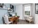 Cozy office space with wood desk, comfortable chair, and bright natural light at 7753 Waterscape Dr, Groveland, FL 34736