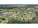 Aerial view of the neighborhood, showing the many single Gathering homes and the lake at 7905 Golden Pond Cir, Kissimmee, FL 34747