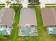 Aerial view of house showing roof, backyard pool, patio and lanai at 7905 Golden Pond Cir, Kissimmee, FL 34747