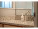 Elegant bathroom sink with granite countertop and modern faucet, combining style and functionality at 7905 Golden Pond Cir, Kissimmee, FL 34747