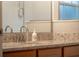 Elegant bathroom sink with granite countertop, stylish faucet, and modern vanity at 7905 Golden Pond Cir, Kissimmee, FL 34747