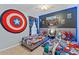 Playful bedroom featuring two beds, cartoon character decor and tile floors at 7905 Golden Pond Cir, Kissimmee, FL 34747