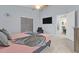 This primary bedroom has a ceiling fan, king size bed, and a sunny window at 7905 Golden Pond Cir, Kissimmee, FL 34747