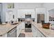 Modern kitchen with granite countertops, stainless steel appliances and tile floors at 7905 Golden Pond Cir, Kissimmee, FL 34747