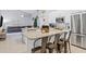Open concept kitchen with island seating and stainless steel appliances at 7905 Golden Pond Cir, Kissimmee, FL 34747