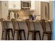 Kitchen with granite countertops, stainless steel appliances, and breakfast bar at 7905 Golden Pond Cir, Kissimmee, FL 34747