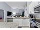Updated kitchen featuring granite countertops, stainless appliances, and a breakfast bar at 7905 Golden Pond Cir, Kissimmee, FL 34747