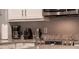 This kitchen has stainless steel appliances and a light countertop at 7905 Golden Pond Cir, Kissimmee, FL 34747