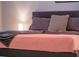 Calm main bedroom featuring a comfortable bed with soft, neutral-toned bedding and headboard at 7905 Golden Pond Cir, Kissimmee, FL 34747