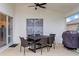Covered patio with outdoor dining set, ideal for enjoying meals and gatherings in a shaded space at 7905 Golden Pond Cir, Kissimmee, FL 34747