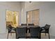 Covered patio featuring an outdoor dining set, perfect for entertaining or relaxing outdoors at 7905 Golden Pond Cir, Kissimmee, FL 34747